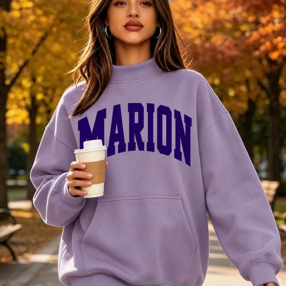Model wearing a lavender hoodie with bold purple MARION lettering